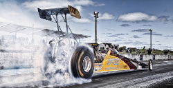 Drag racer spinning its wheels